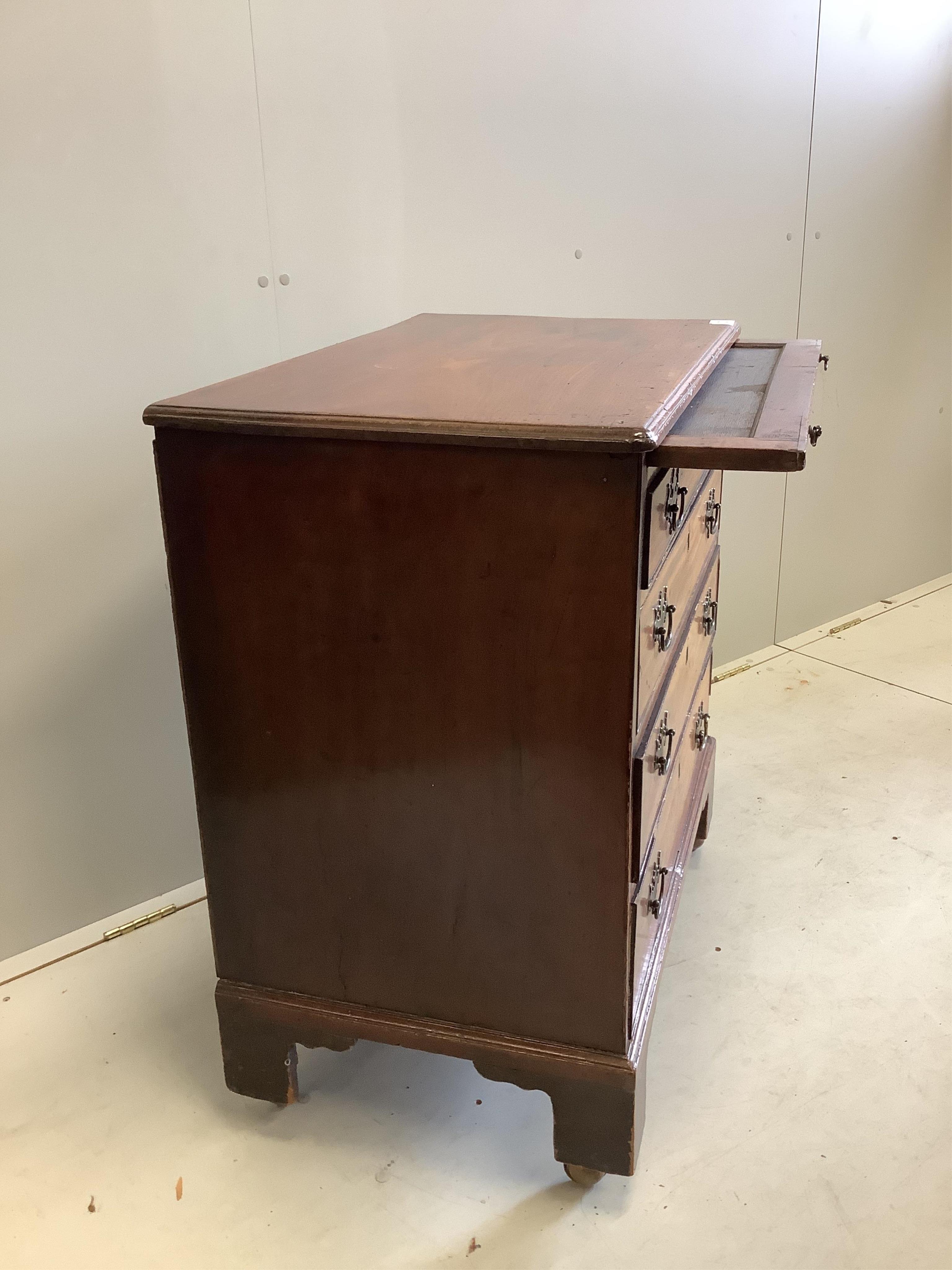 A small George III mahogany chest of four graduated drawers, fitted slide, width 76cm, depth 46cm, height 84cm